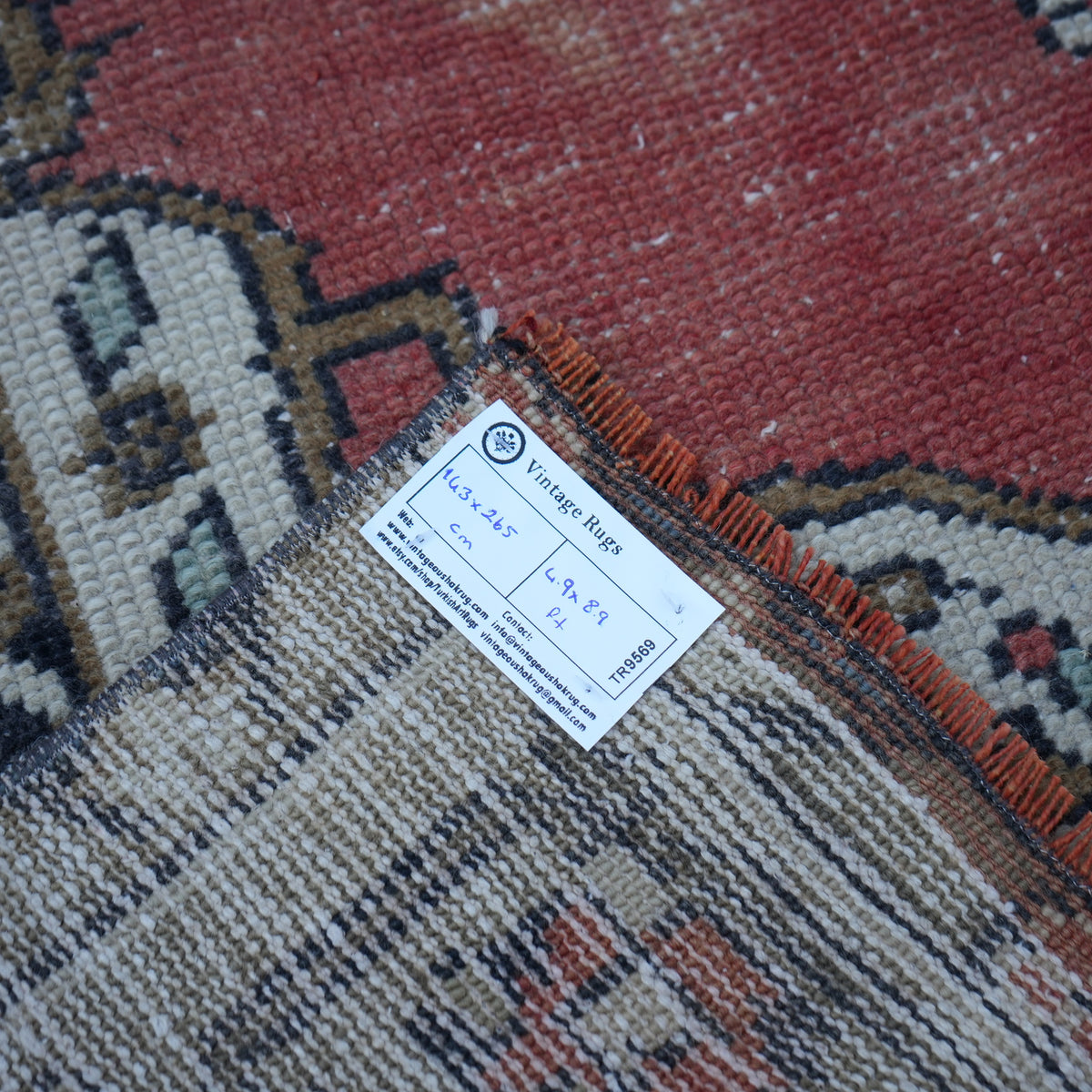 Red 5' x 9' vintage Turkish tradiitonal rug from the 1970s with traditional design.