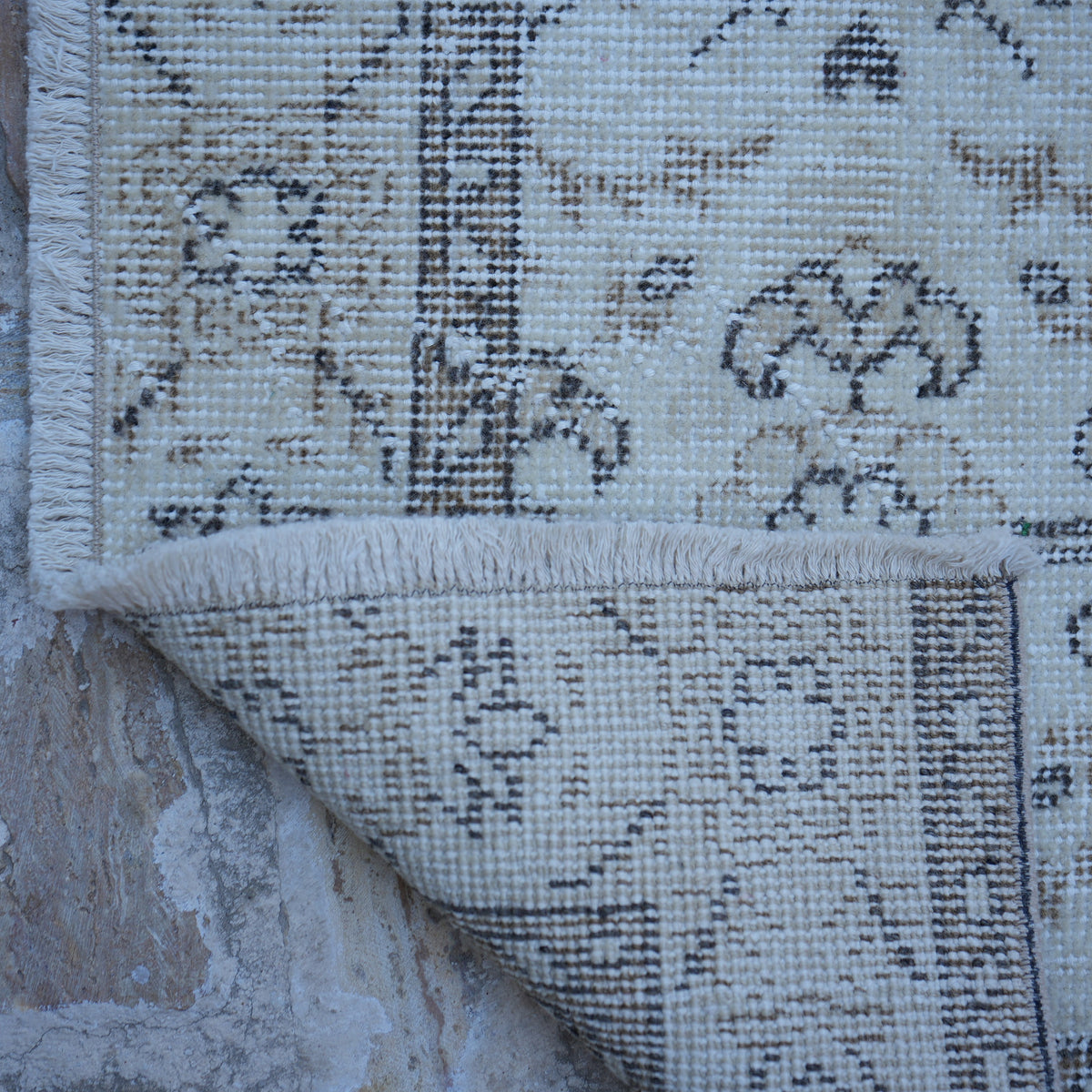 1970s beige vintage Turkish traditional rug with traditional design, hand-knotted weave and low pile.
