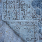 1970s blue vintage Turkish traditional rug with traditional design, hand-knotted weave and low pile.