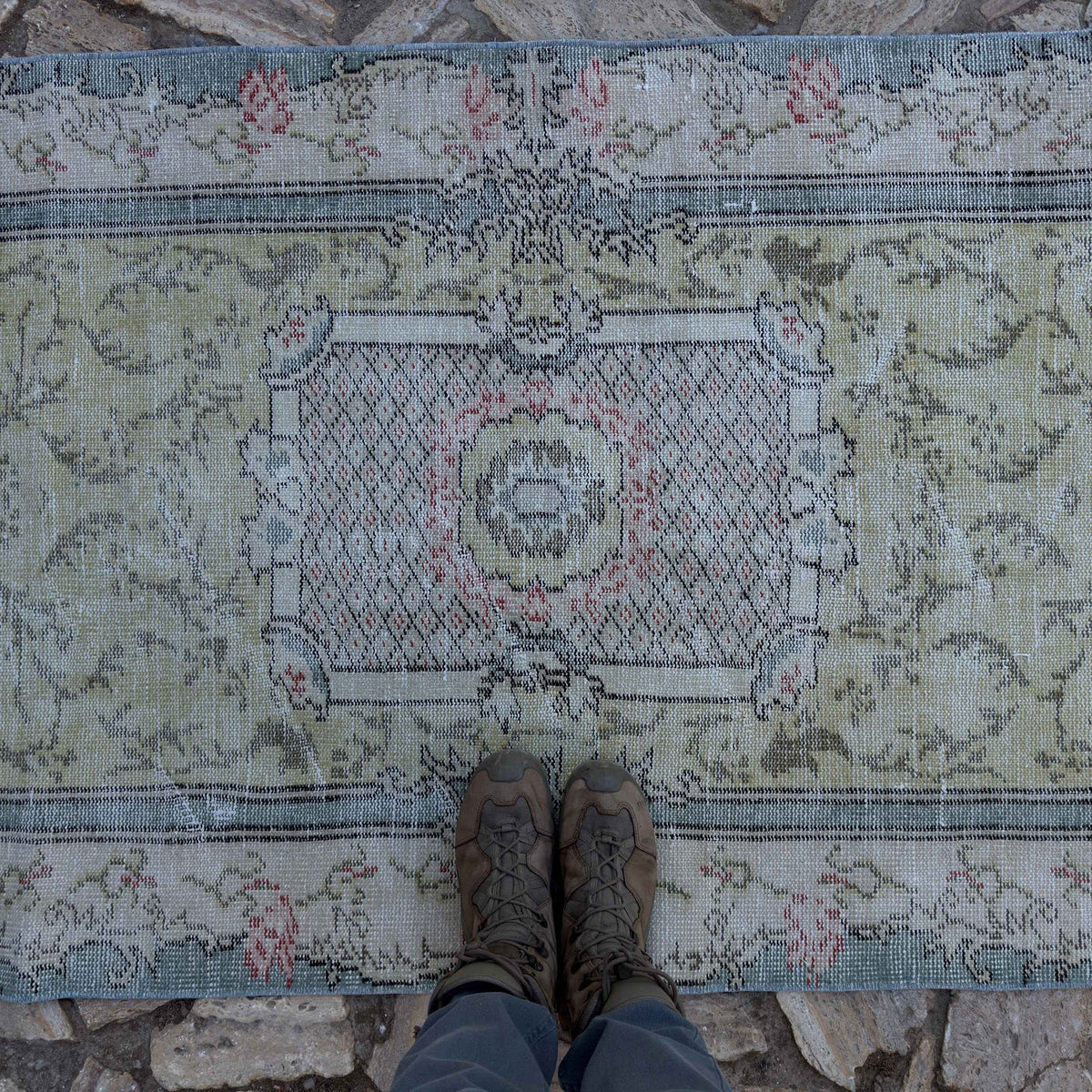 1970s pale green vintage Turkish traditional rug with traditional design, hand-knotted weave and low pile.