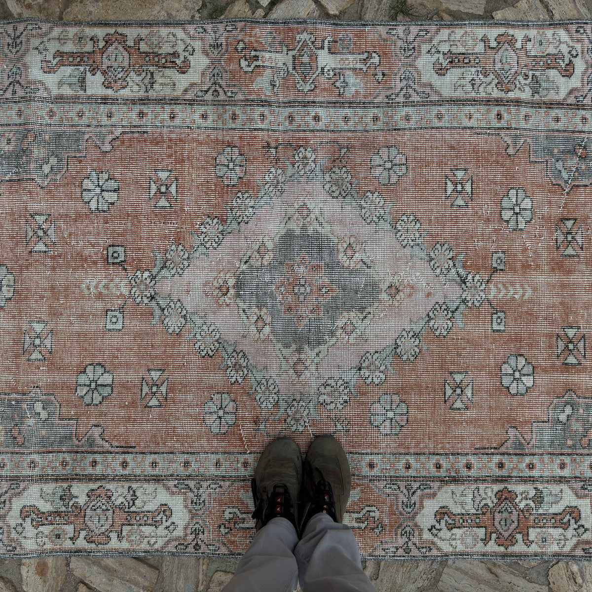 1970s pale orange vintage Turkish traditional rug with medallion design, hand-knotted weave and low pile.