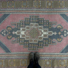 1970s pale red vintage Turkish traditional rug with traditional design, hand-knotted weave and low pile.