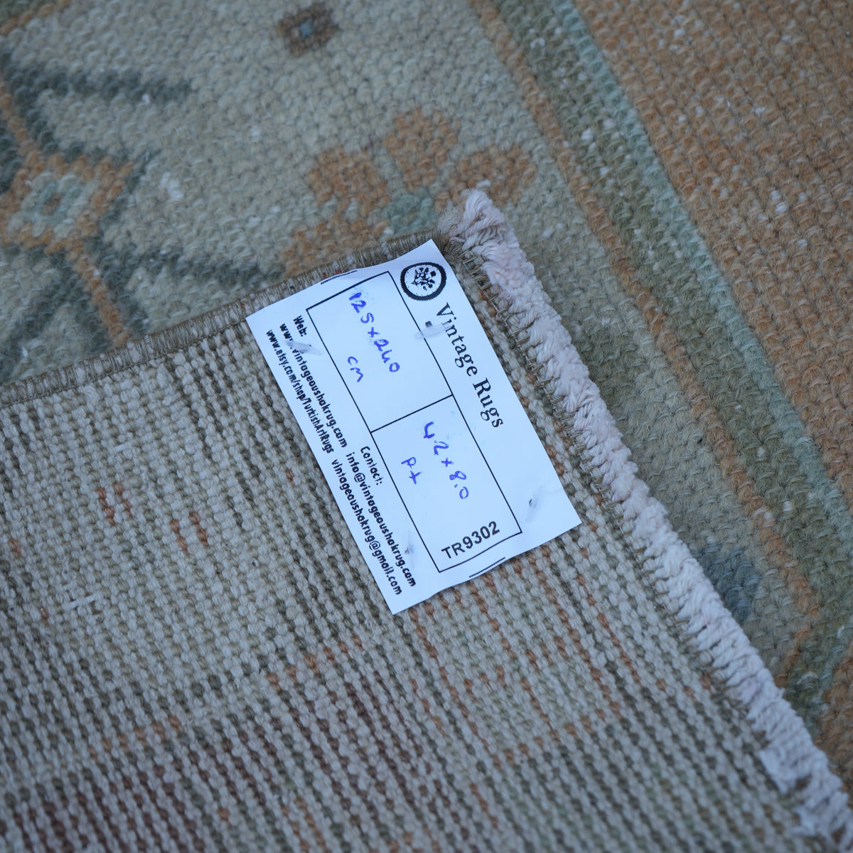 Orange 4' x 8' vintage Turkish traditional rug from the 1970s with traditional design.