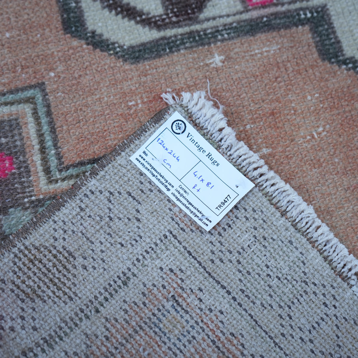 Orange 4' x 8' vintage Turkish traditional rug from the 1970s with traditional design.