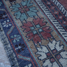 Red 4' x 8' vintage Turkish traditional rug in wool, shown on the floor.