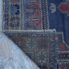 1970s red vintage Turkish traditional rug with medallion design, hand-knotted weave and low pile.