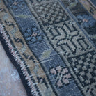 Pink 5' x 10' vintage Turkish traditional rug in wool and cotton, shown on the floor.