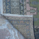 1970s pink vintage Turkish traditional rug with traditional design, hand-knotted weave and low pile.