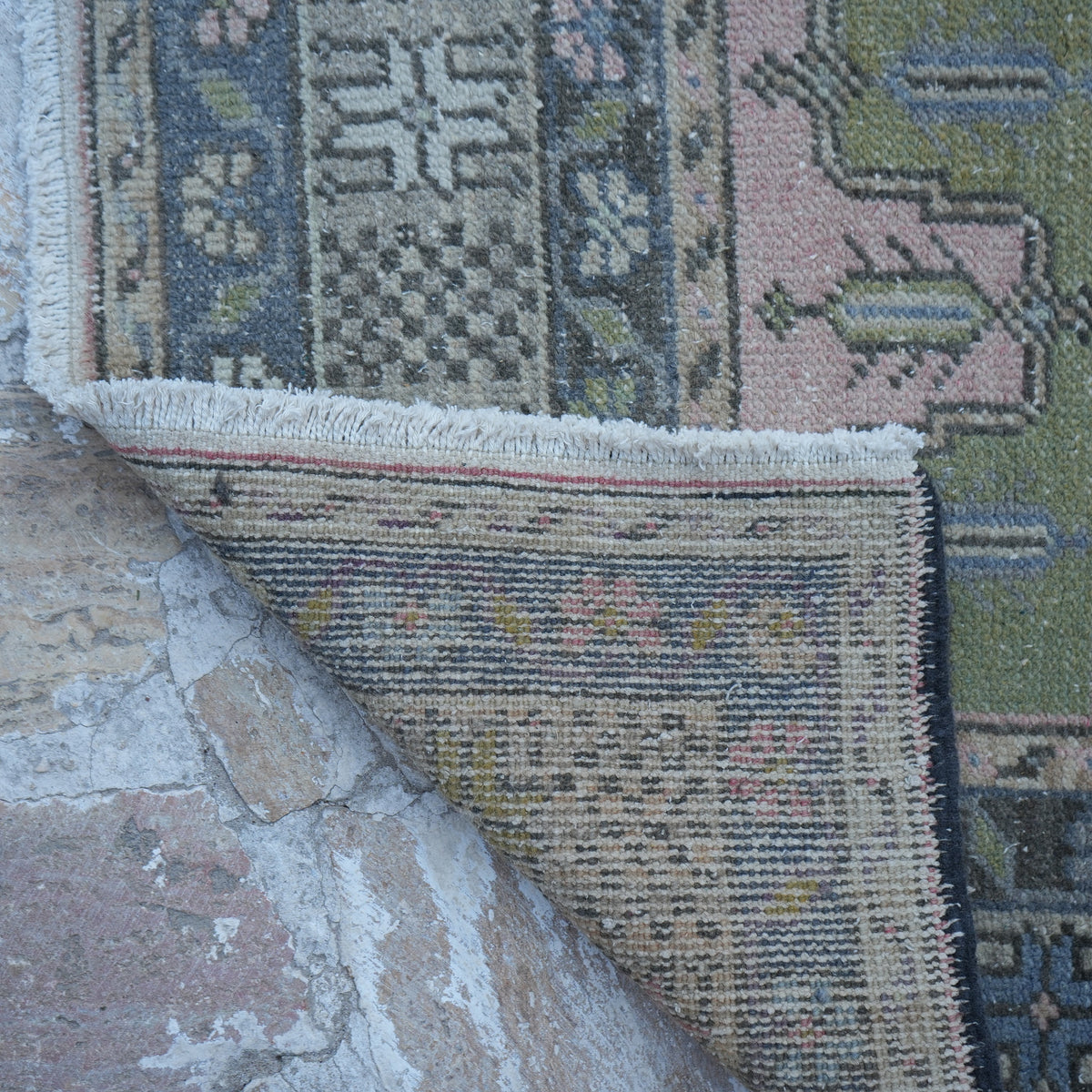 1970s pink vintage Turkish traditional rug with traditional design, hand-knotted weave and low pile.
