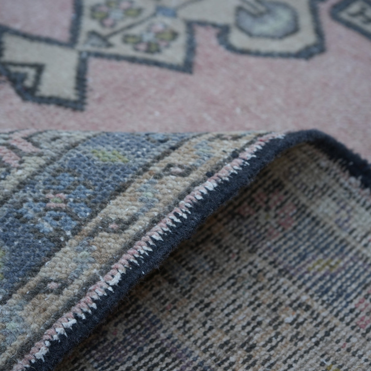 Additional view of the pink vintage Turkish traditional rug, hand-knotted in wool and cotton.