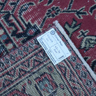 Red 5' x 7' vintage Turkish traditional rug from the 1970s with traditional design.