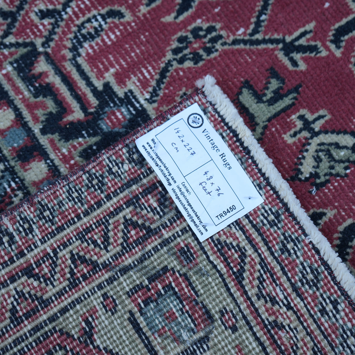 Red 5' x 7' vintage Turkish traditional rug from the 1970s with traditional design.