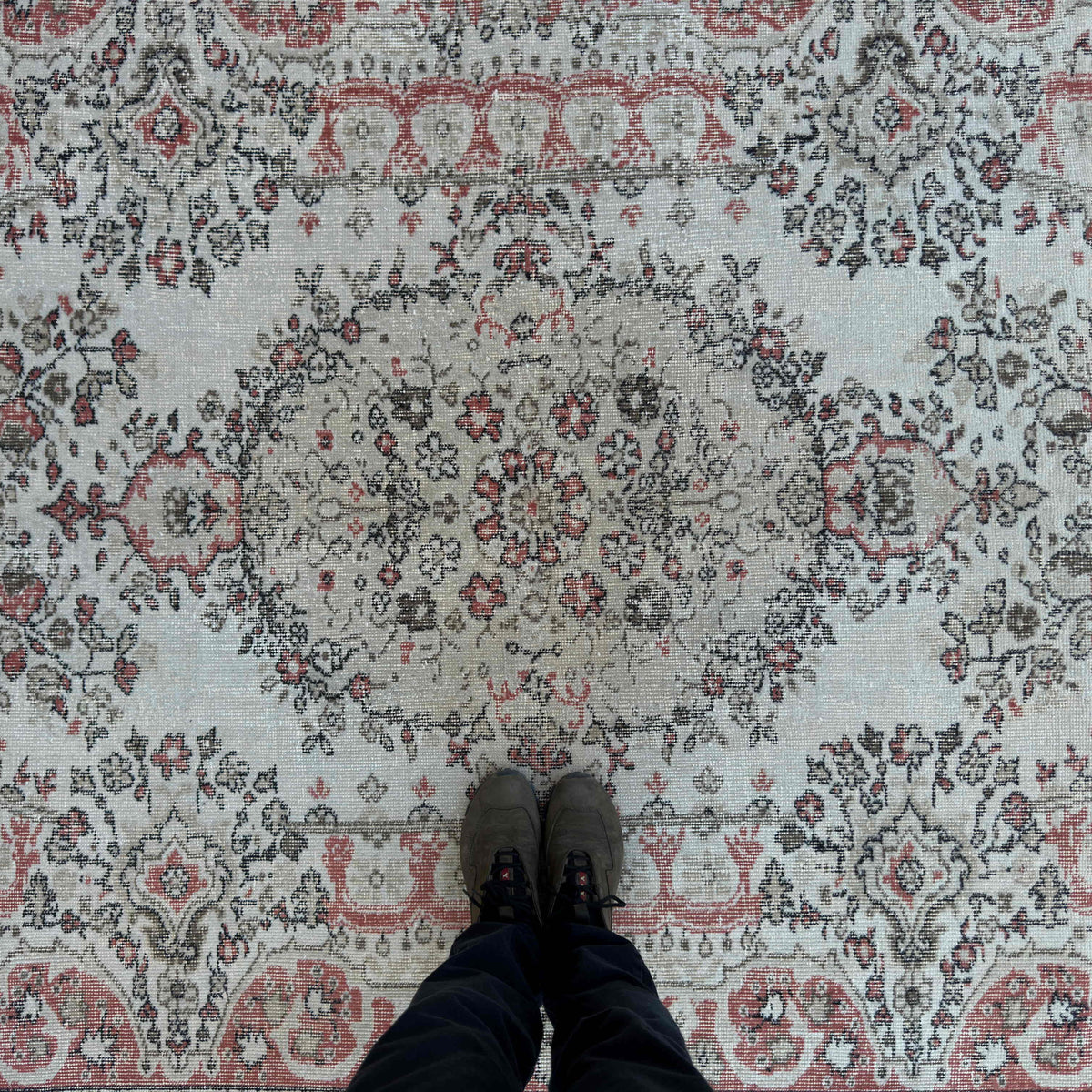 1970s pale red vintage Turkish traditional rug with medallion design, hand-knotted weave and low pile.