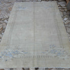 Beige 6' x 8' vintage Turkish traditional rug in wool and cotton, shown on the floor.