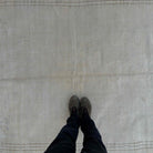1970s beige vintage Turkish traditional rug with traditional design, hand-knotted weave and low pile.