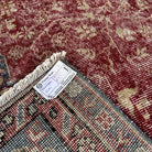 1970s red vintage Turkish traditional rug with medallion design, hand-knotted weave and low pile.