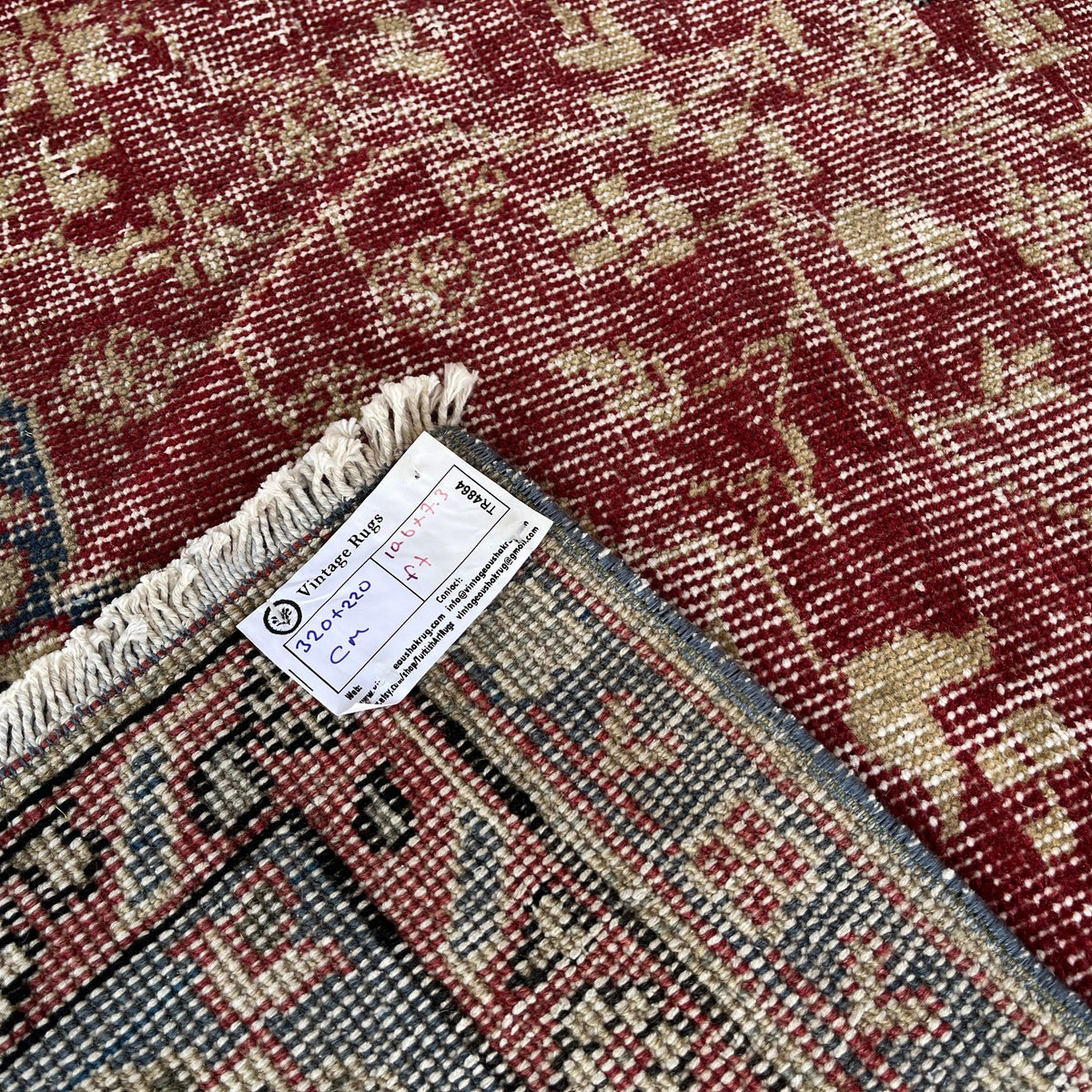 1970s red vintage Turkish traditional rug with medallion design, hand-knotted weave and low pile.
