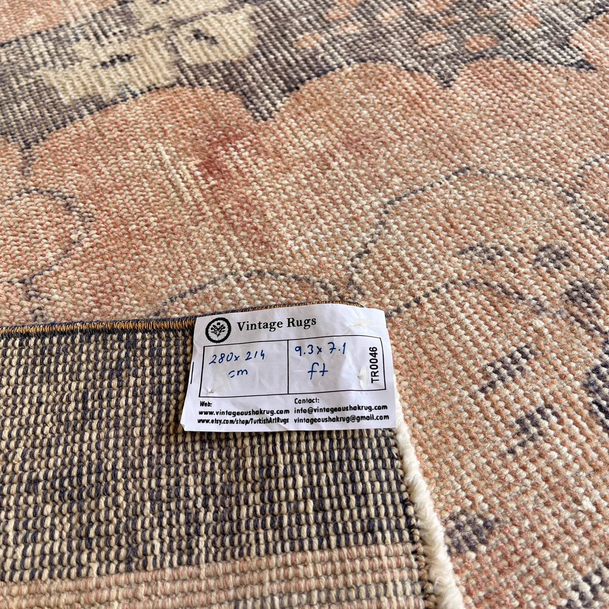 1970s pink vintage Turkish traditional rug with traditional design, hand-knotted weave and low pile.