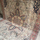 Pale Red 8' x 12' vintage Turkish traditional rug in wool and cotton, shown on the floor.