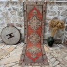 Red 3' x 11' vintage traditional runner rug with medallion design, handmade in Turkey – Lexi.
