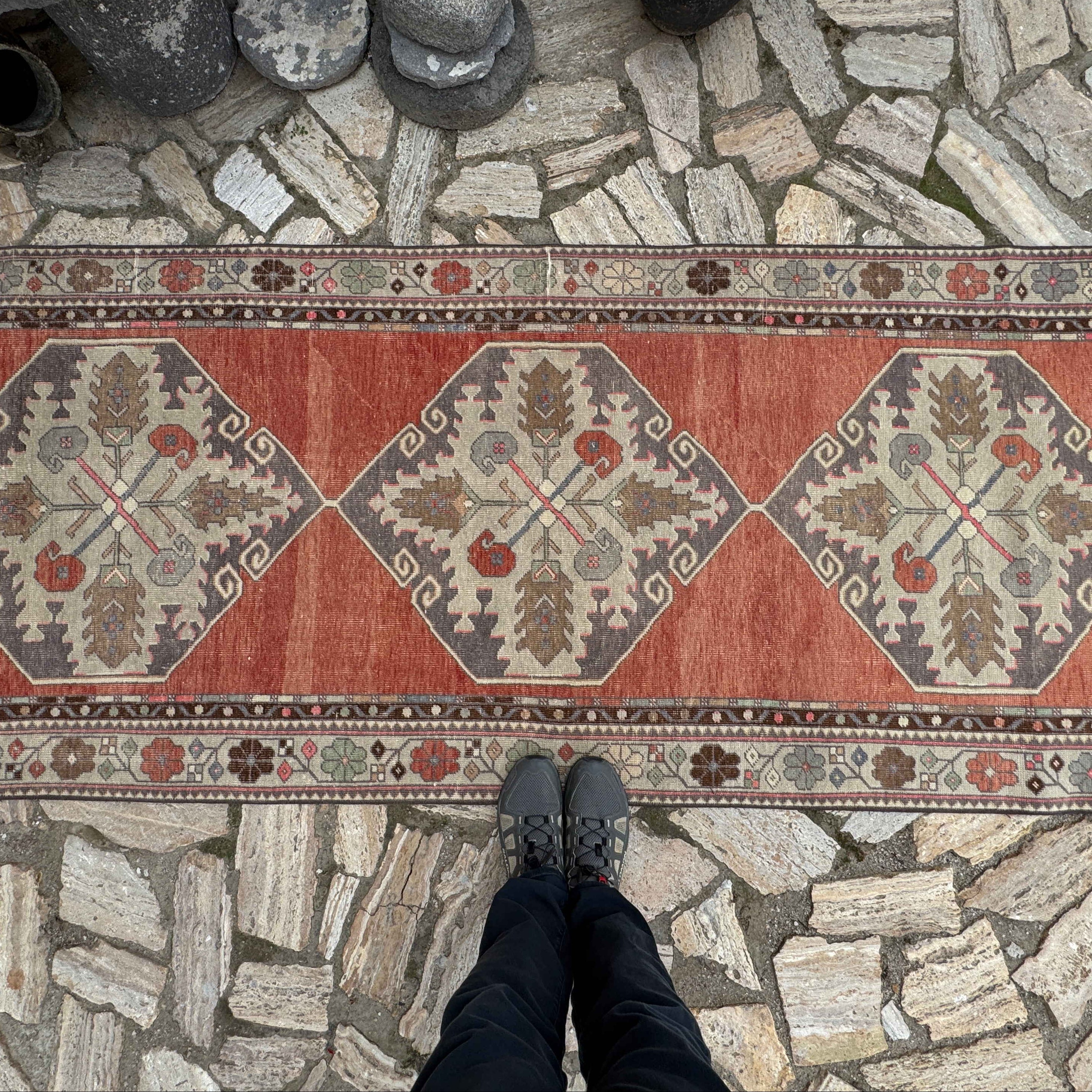 1970s red vintage Turkish traditional runner rug with medallion design, hand-knotted weave and low pile.