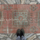 1970s pale red vintage Turkish traditional runner rug with traditional design, hand-knotted weave and low pile.