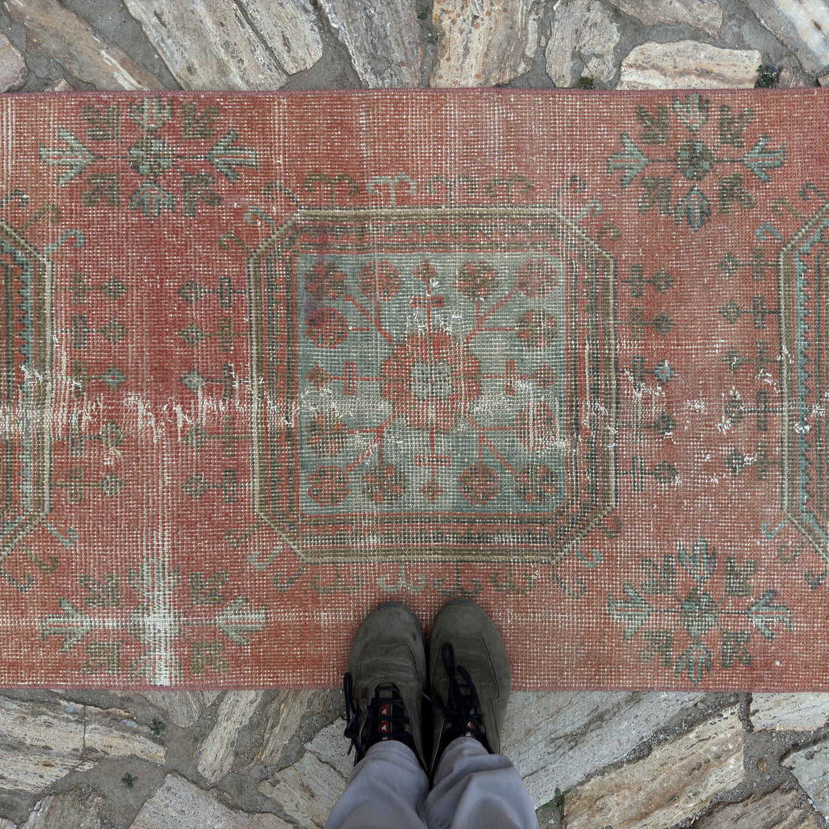 1970s pale red vintage Turkish traditional runner rug with traditional design, hand-knotted weave and low pile.