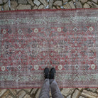 1970s red vintage Turkish traditonal rug with floral design, hand-knotted weave and low pile.
