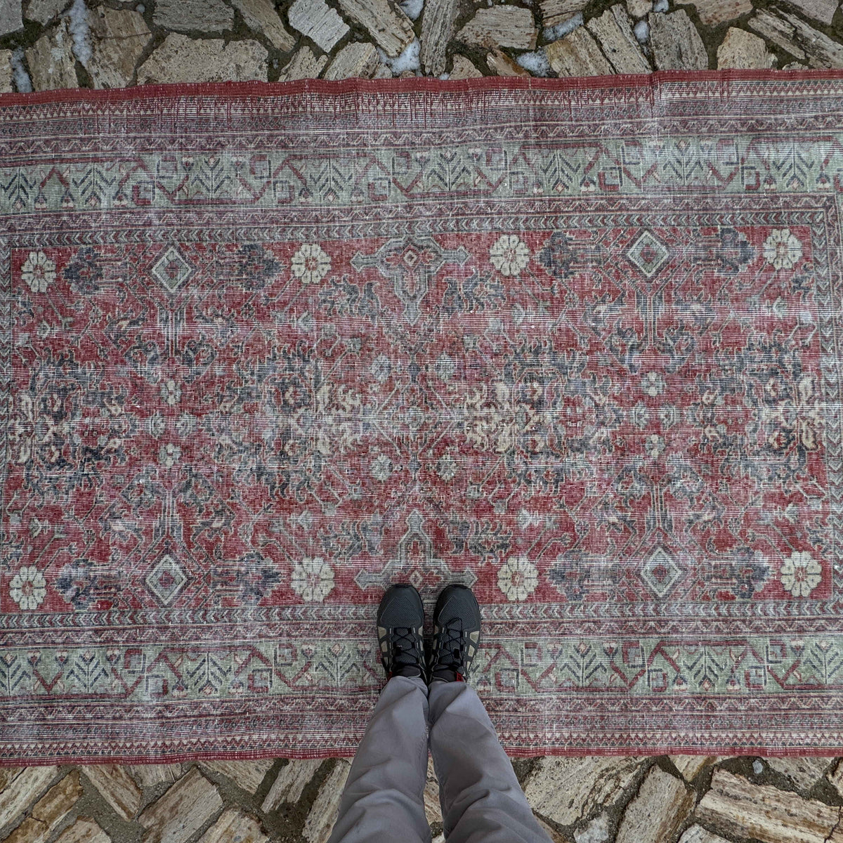 1970s red vintage Turkish traditonal rug with floral design, hand-knotted weave and low pile.