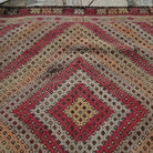 Additional view of the brown vintage Turkish tribal kilim rug with flatweave construction in wool and cotton.