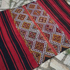 Red 4' x 5' vintage Turkish tribal kilim rug in wool and cotton, shown on the floor.