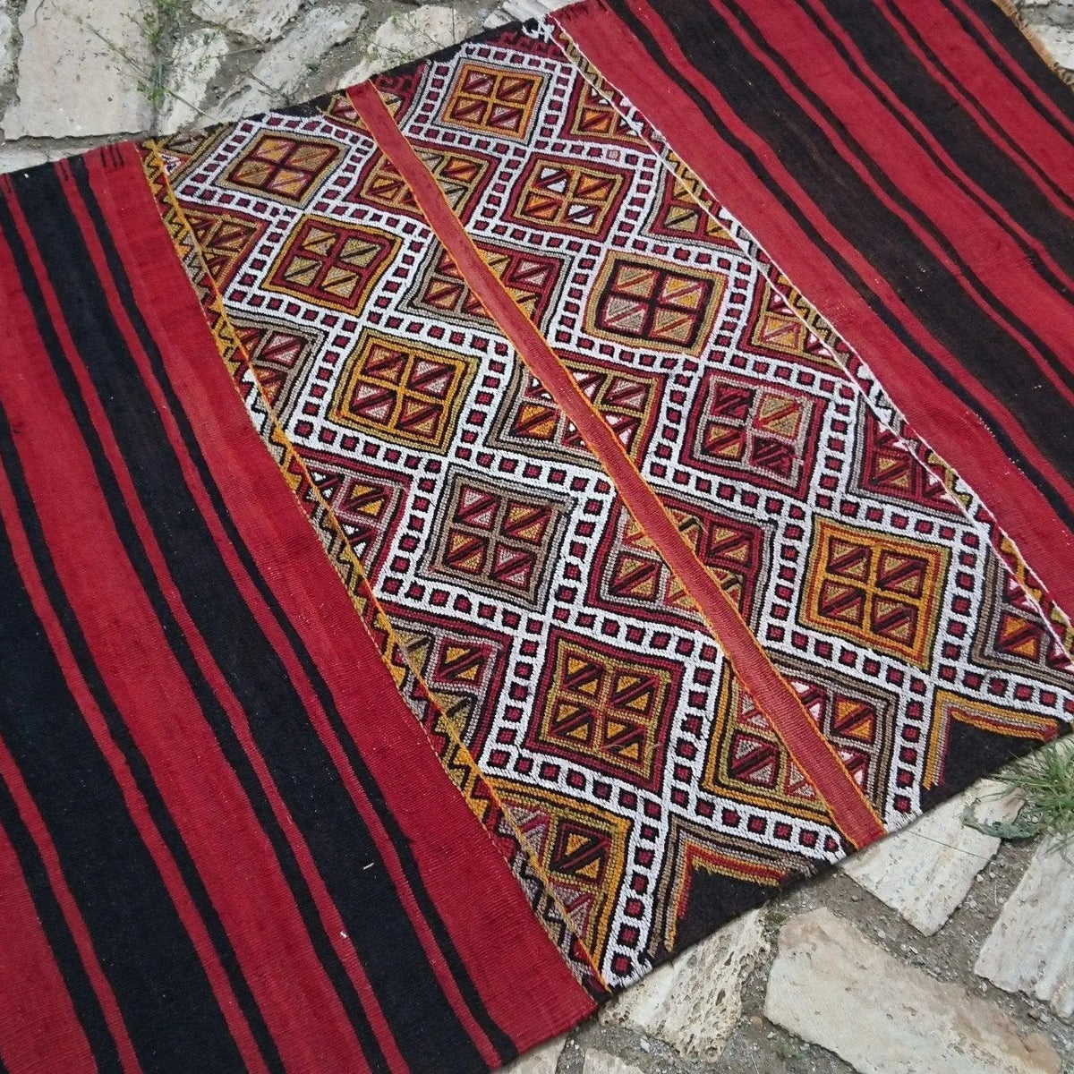 Red 4' x 5' vintage Turkish tribal kilim rug in wool and cotton, shown on the floor.