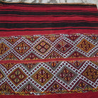 1970s red vintage Turkish tribal kilim rug with striped design, flatweave construction and low pile.
