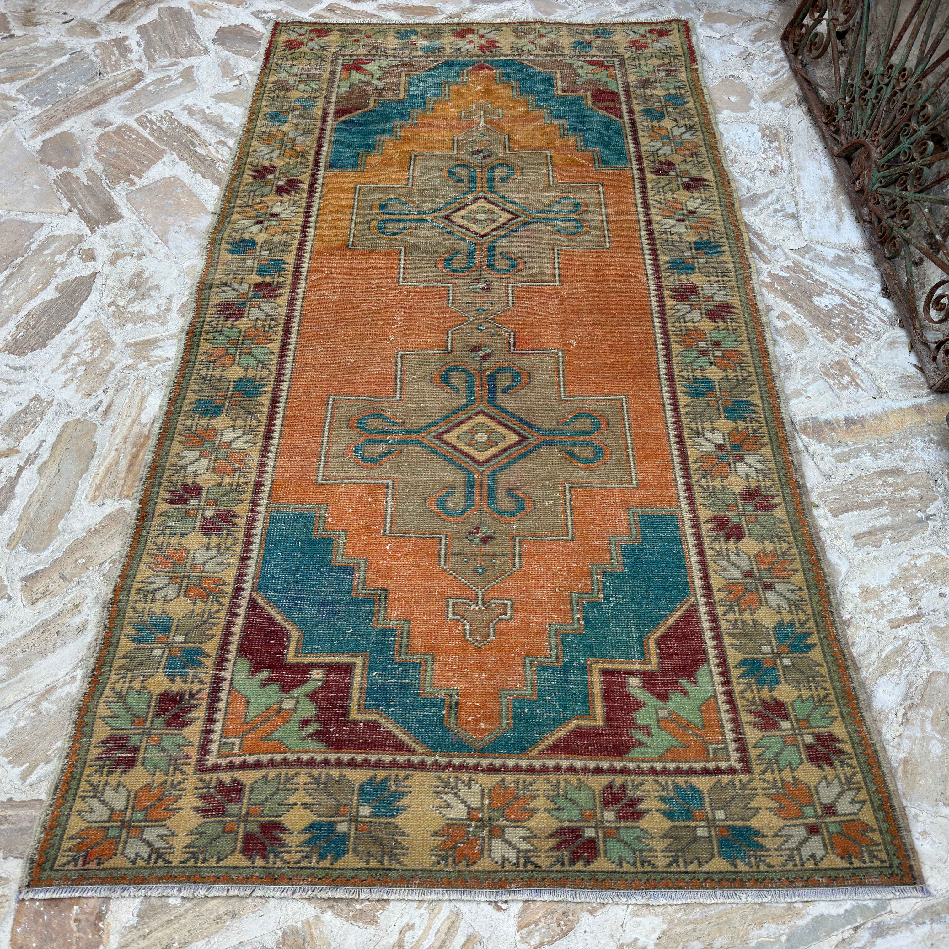 Orange 4' x 8' vintage turkish carpet in wool and cotton, shown on the floor.