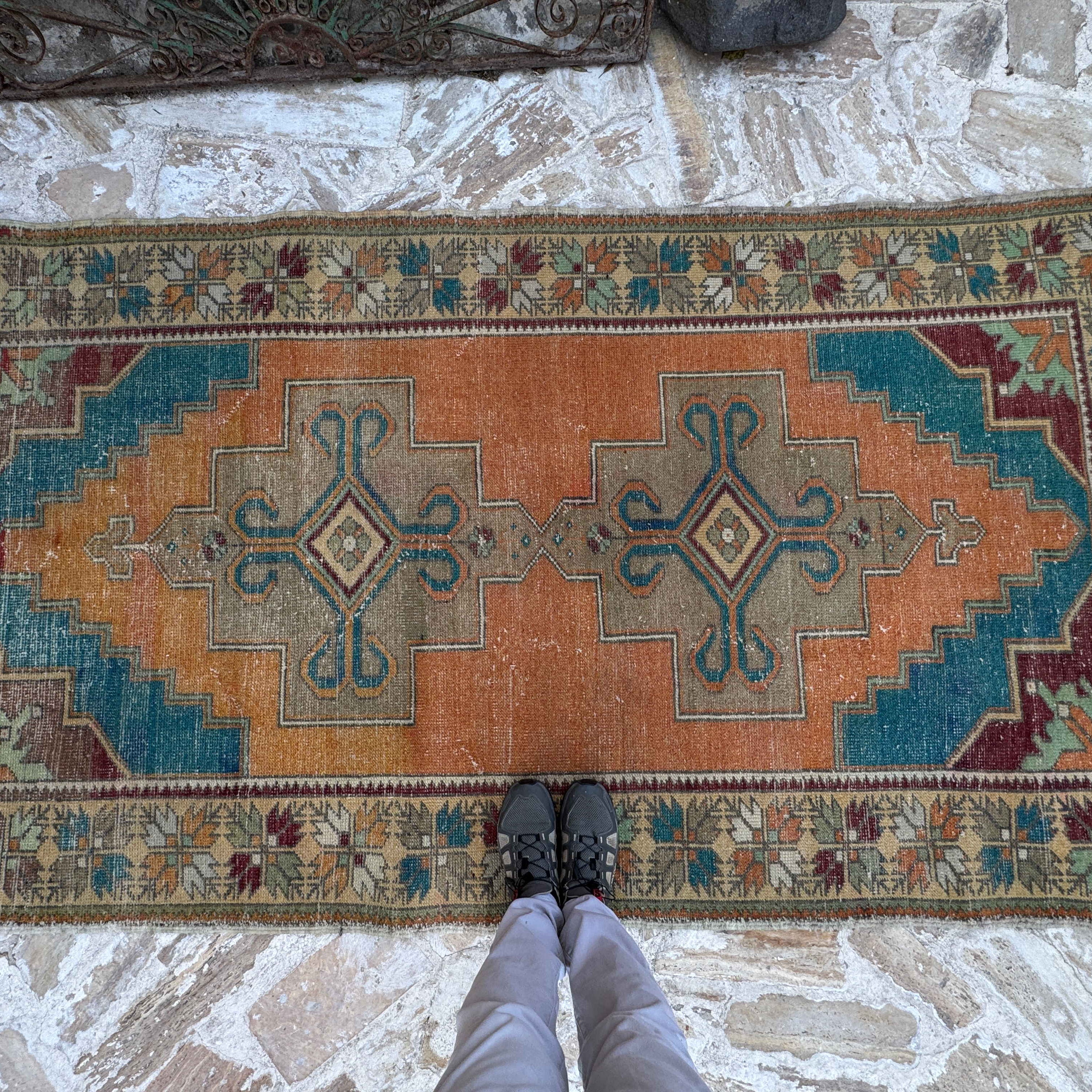1970s orange vintage turkish carpet with medallion design, hand-knotted weave and low pile.