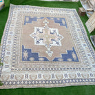 1970s blue vintage turkish rug with geometric design, hand-knotted weave and low pile.