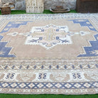 Blue 13' x 15' vintage turkish rug from the 1970s with geometric design.