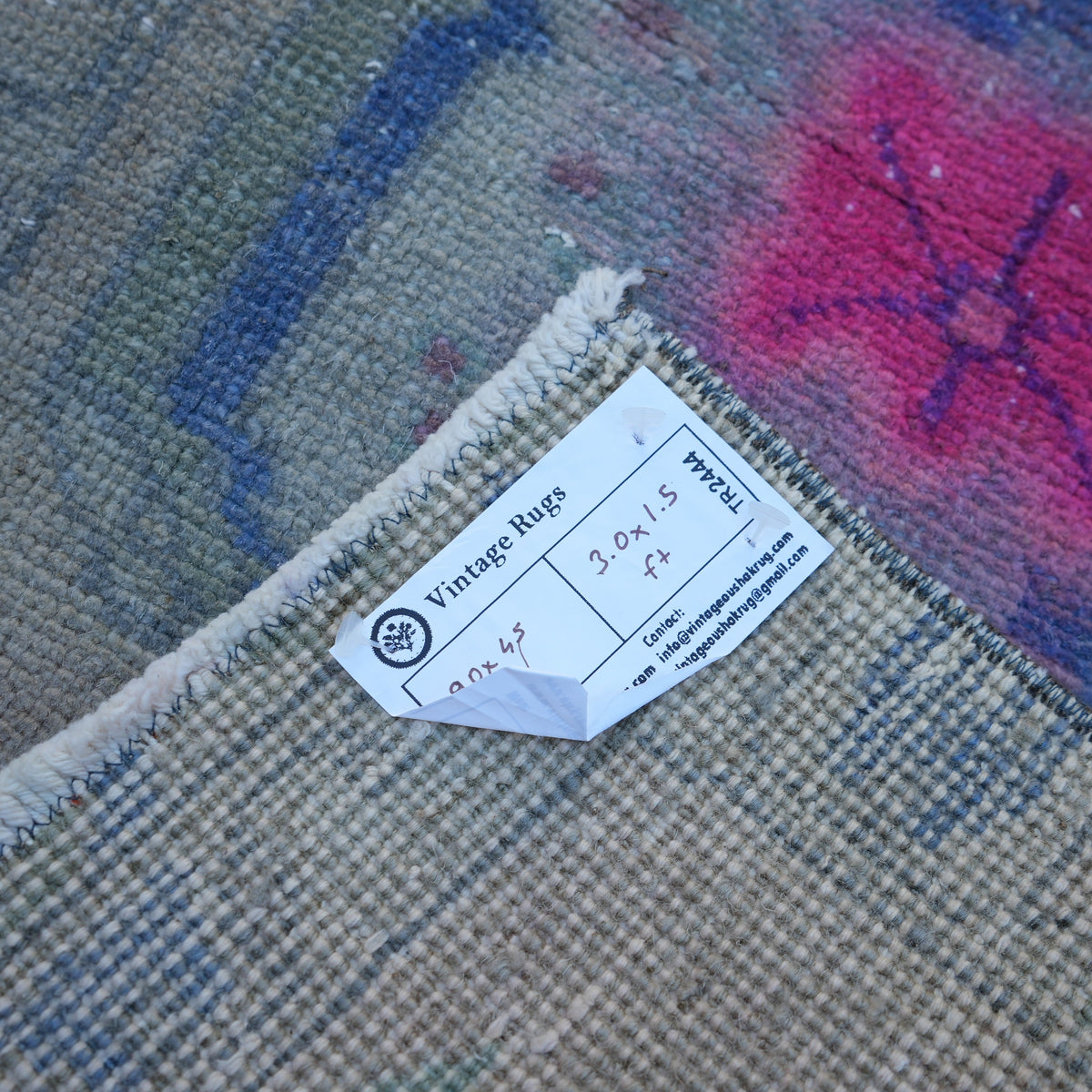 Beige 1' x 3' vintage turkish rug from the 1970s with traditional design.