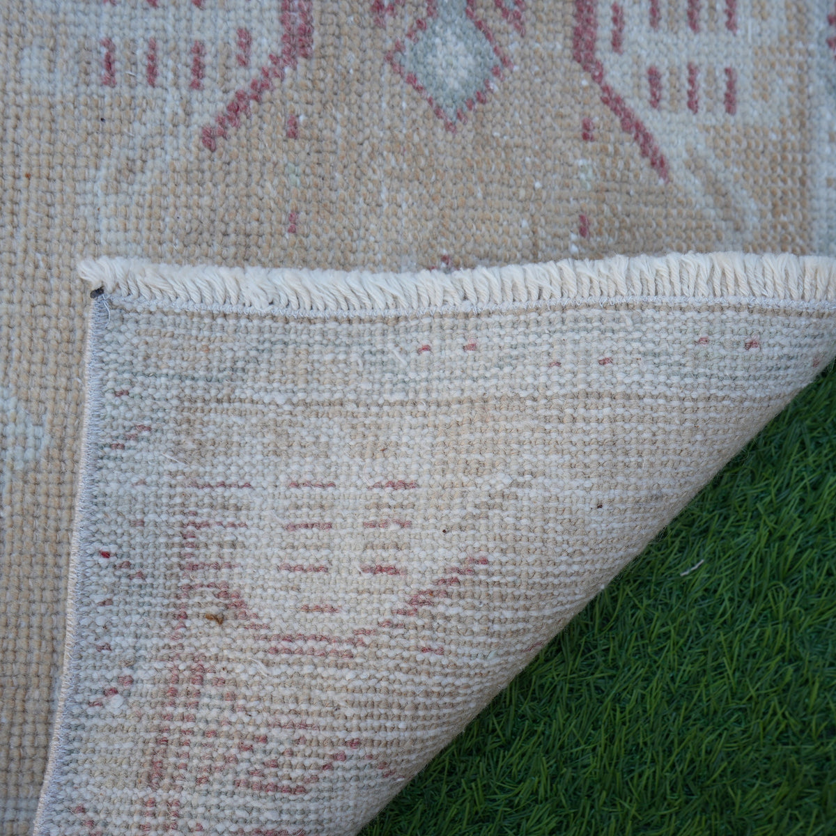 1970s beige vintage turkish rug with traditional design, hand-knotted weave and low pile.