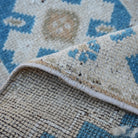 Additional view of the blue vintage turkish rug, hand-knotted in wool and cotton.