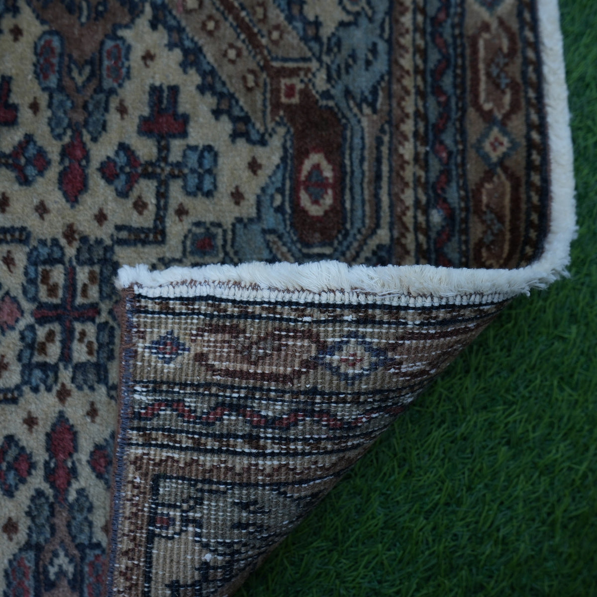 1970s brown vintage turkish rug with traditional design, hand-knotted weave and low pile.