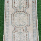 1970s brown vintage turkish rug with neutral design, hand-knotted weave and low pile.