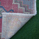 1970s red vintage turkish rug with traditional design, hand-knotted weave and low pile.