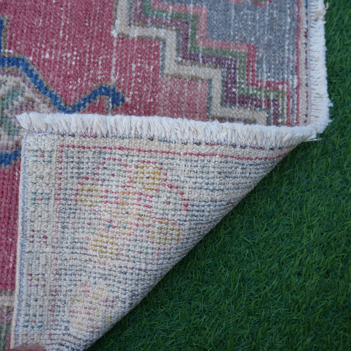 1970s red vintage turkish rug with traditional design, hand-knotted weave and low pile.