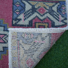 1970s red vintage turkish rug with traditional design, hand-knotted weave and low pile.