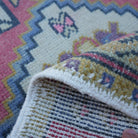 Additional view of the red vintage turkish rug, hand-knotted in wool and cotton.