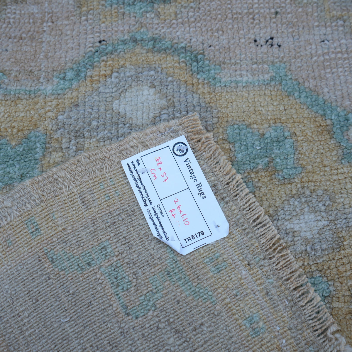 Beige 2' x 2' vintage turkish rug from the 1970s with neutral design.