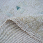 Additional view of the beige vintage turkish rug, hand-knotted in wool and cotton.