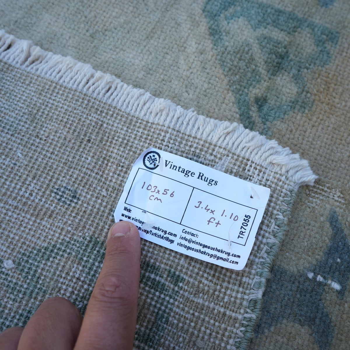 Beige 2' x 3' vintage turkish rug from the 1970s with neutral design.