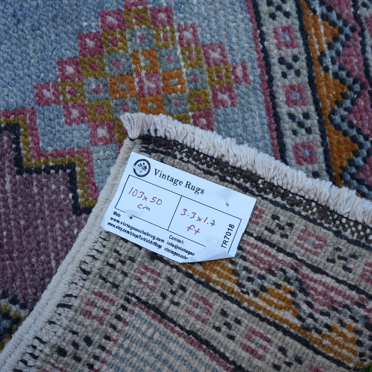 Blue 2' x 3' vintage turkish rug from the 1970s with traditional design.